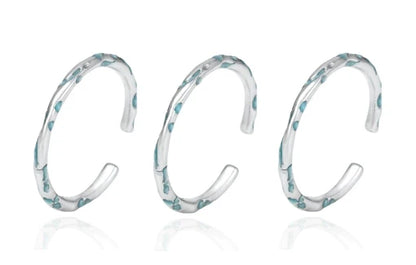 FXPX Ocean Breeze Ring in Silver with Elegant Wave Design and Aqua Accents