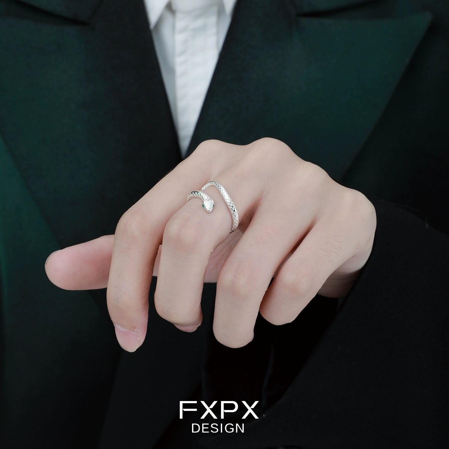 Stylish Ouroboros silver ring by FXPX on a model's hand, showcasing a unique design and craftsmanship