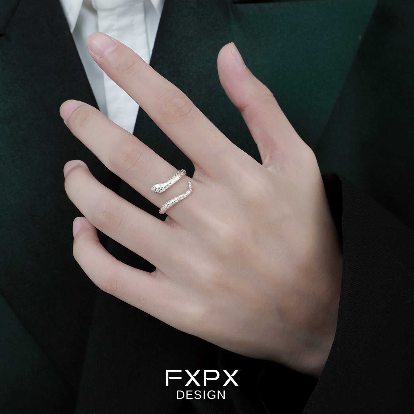 FXPX Ouroboros silver ring stylishly worn on a hand for modern fashion enthusiasts