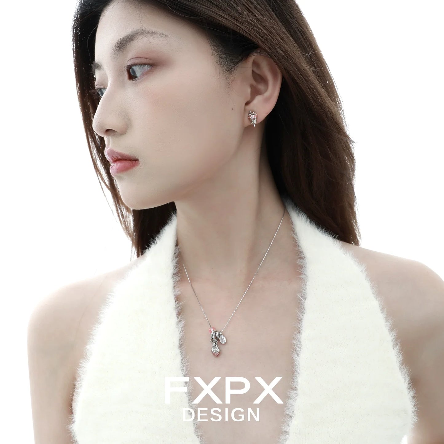 Stylish pink strawberry stud earrings from FXPX worn by a model for a chic look