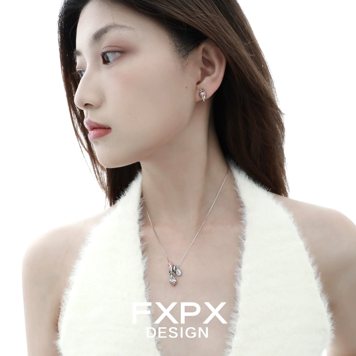 Stylish pink strawberry stud earrings from FXPX worn by a model for a chic look