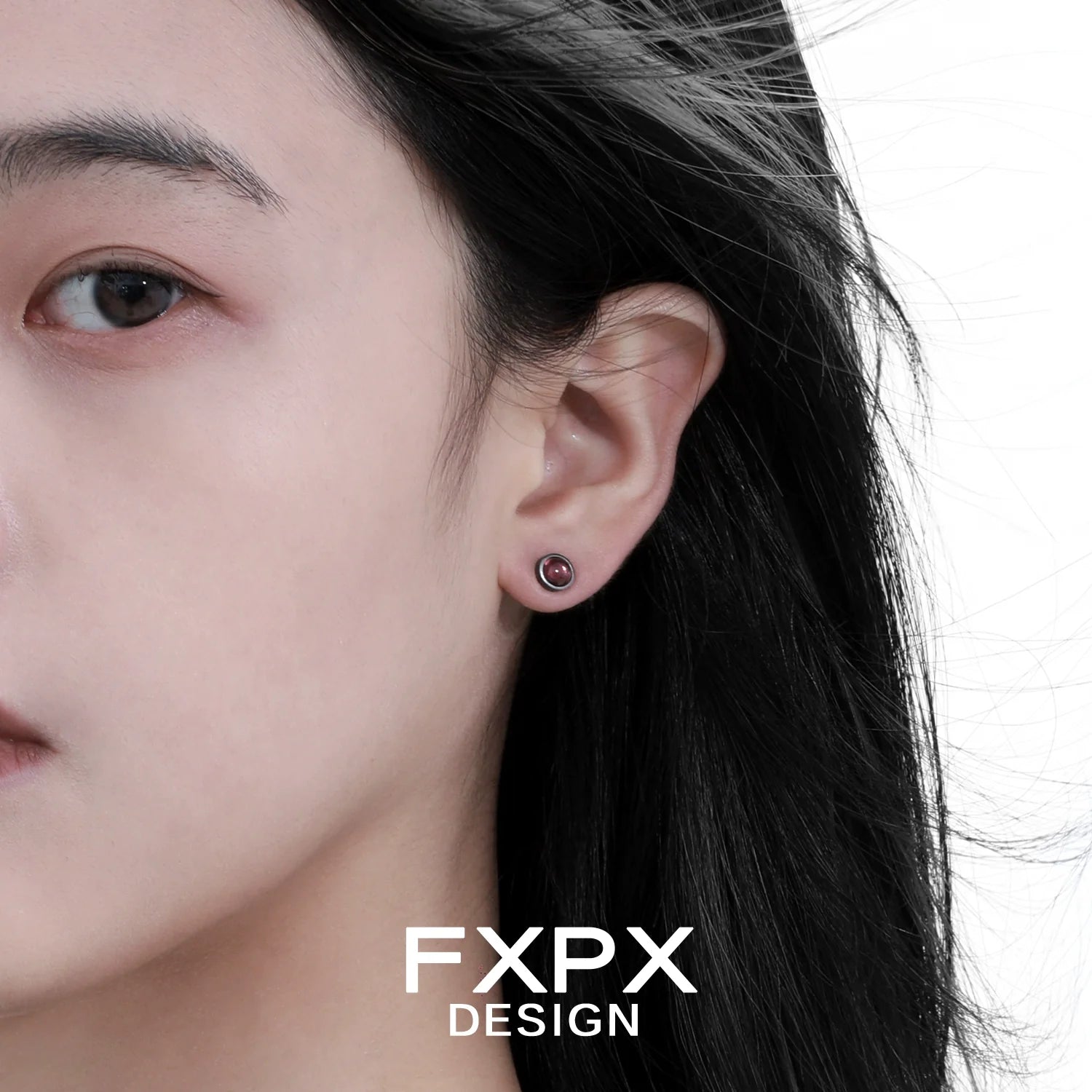 Punk crystal stud earrings showcased on model with dark hair for a trendy look