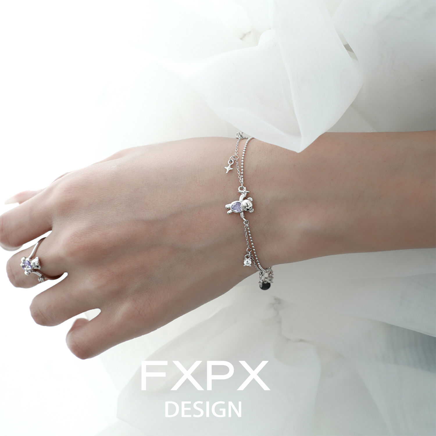 Stylish purple bear charm bracelet from FXPX featuring delicate charms and a silver chain