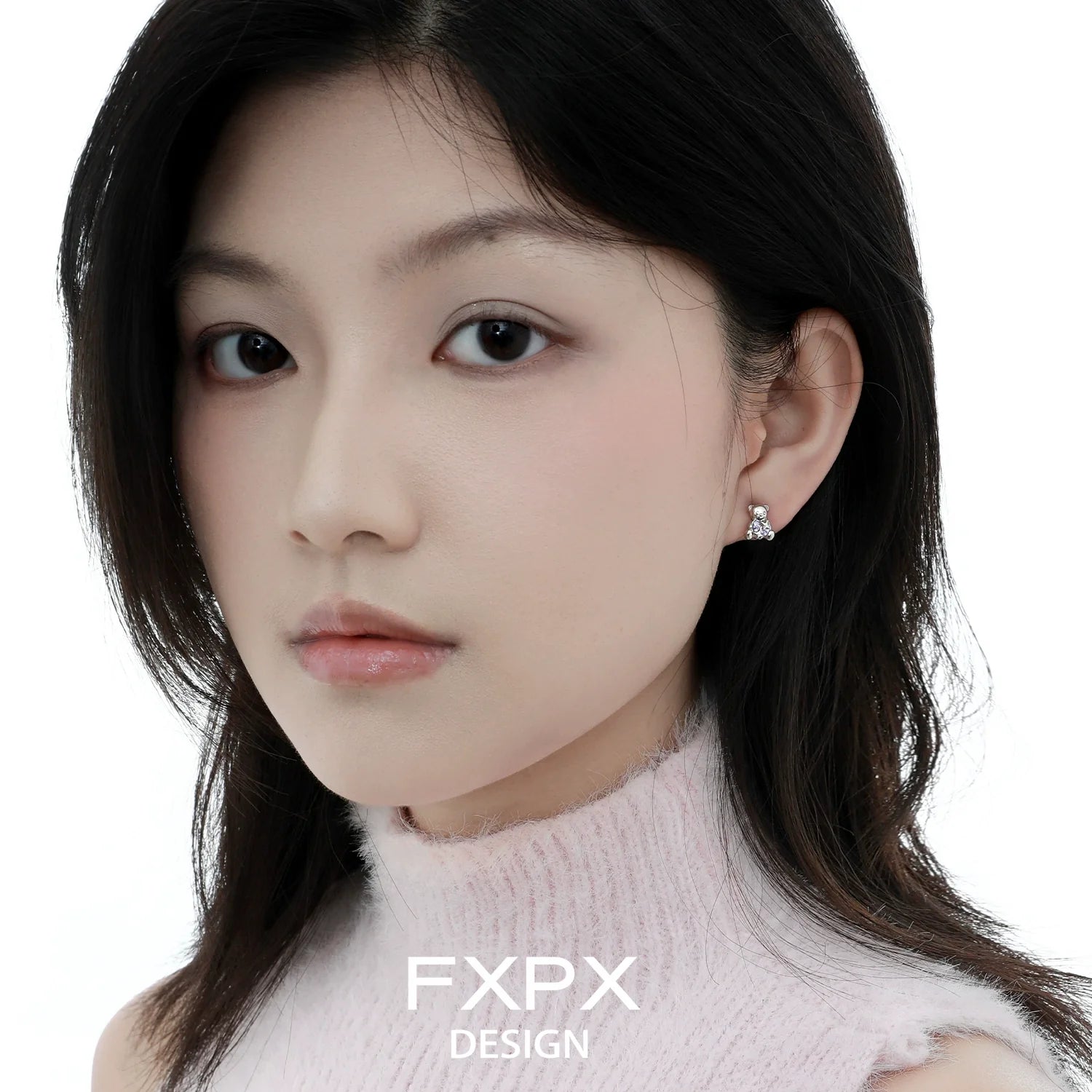 Elegant model wearing purple bear stud earrings that add a playful touch to any outfit