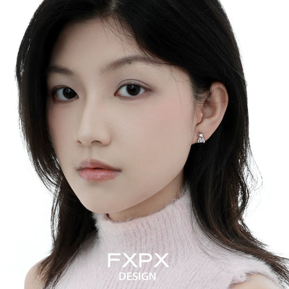 Elegant model wearing purple bear stud earrings that add a playful touch to any outfit