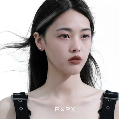 Model wearing radiant star silver stud earrings showcasing elegant design and sparkling details