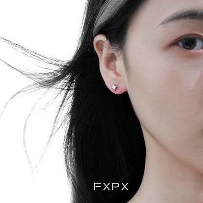 FXPX radiant star silver stud earrings displayed on a model's ear for a stylish look