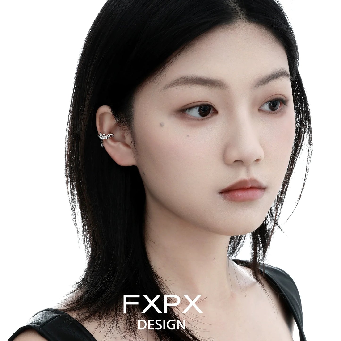 Elegant model wearing FXPX red zircon ear clips that enhance any outfit with stylish flair