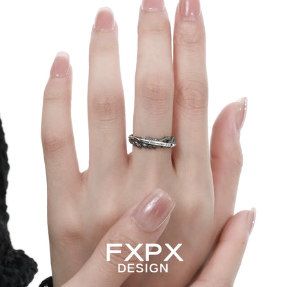 FXPX Roman numeral couple rings featuring a stylish design on a model's hand
