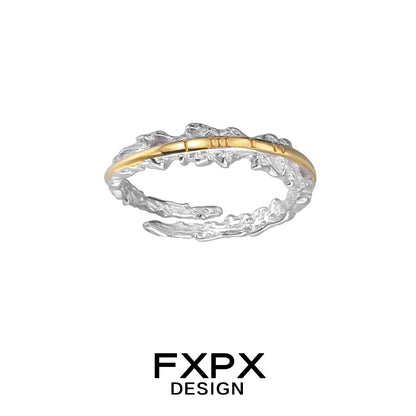 Elegant FXPX roman numeral couple rings featuring a unique twisted design with gold and silver tones.