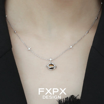 FXPX Saturn tiger's eye necklace on a model, featuring a silver chain and unique design