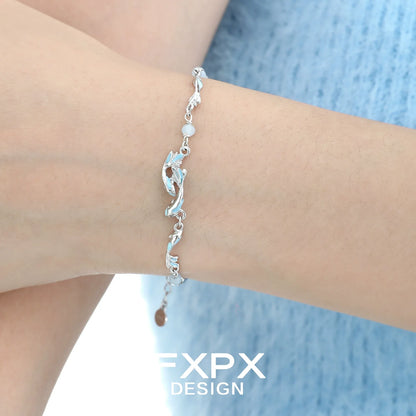 Stylish FXPX sea bluefish beaded bracelet worn on a wrist with a feminine design