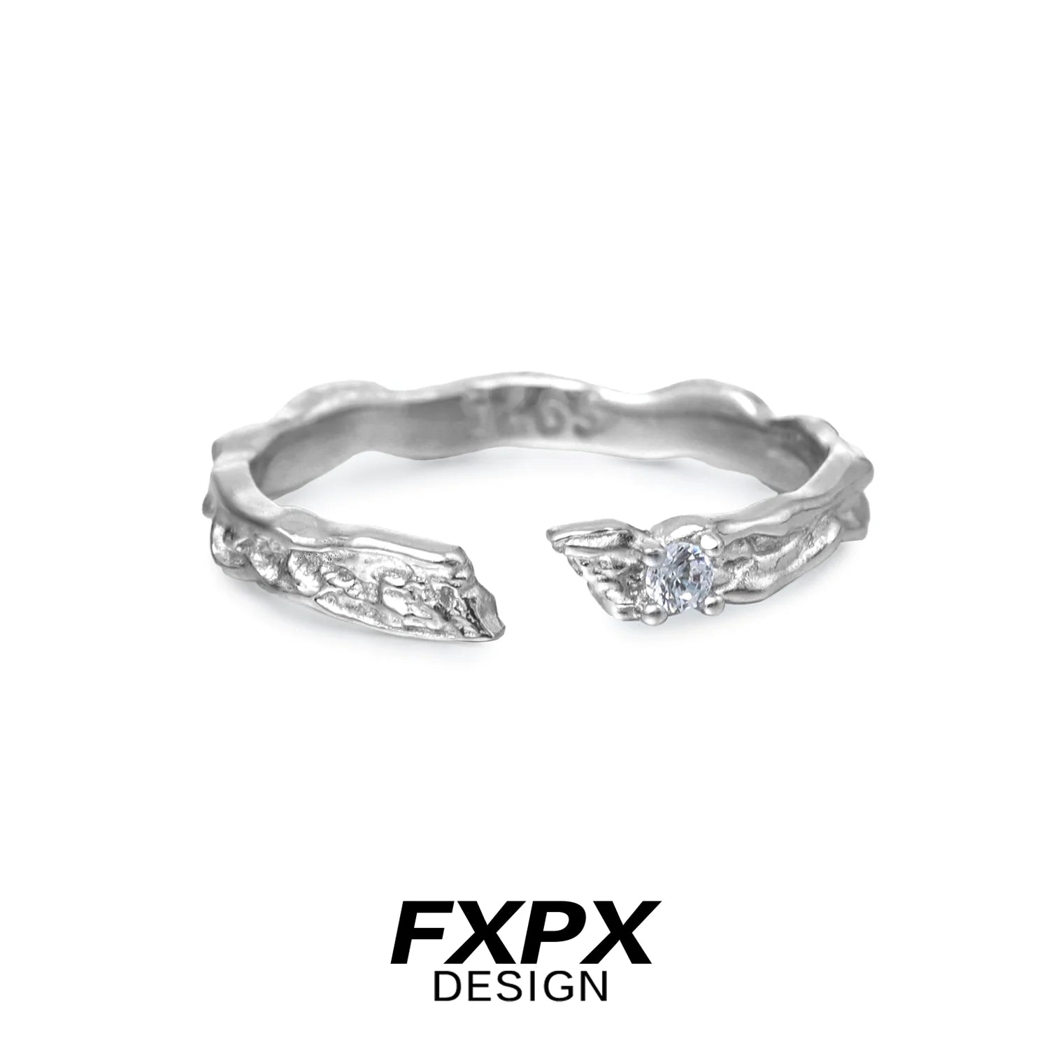 FXPX secret bond couple rings in textured silver design with a sparkling gemstone accent