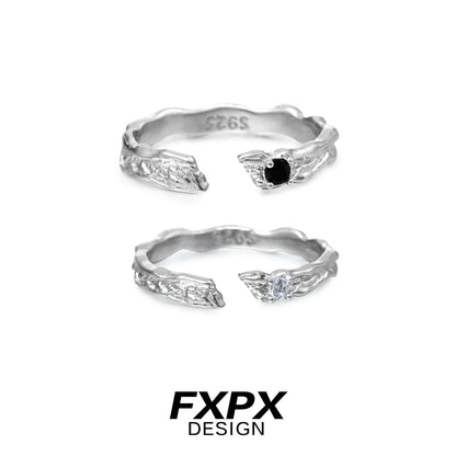 FXPX secret bond couple rings in silver featuring elegant designs with black and white stones