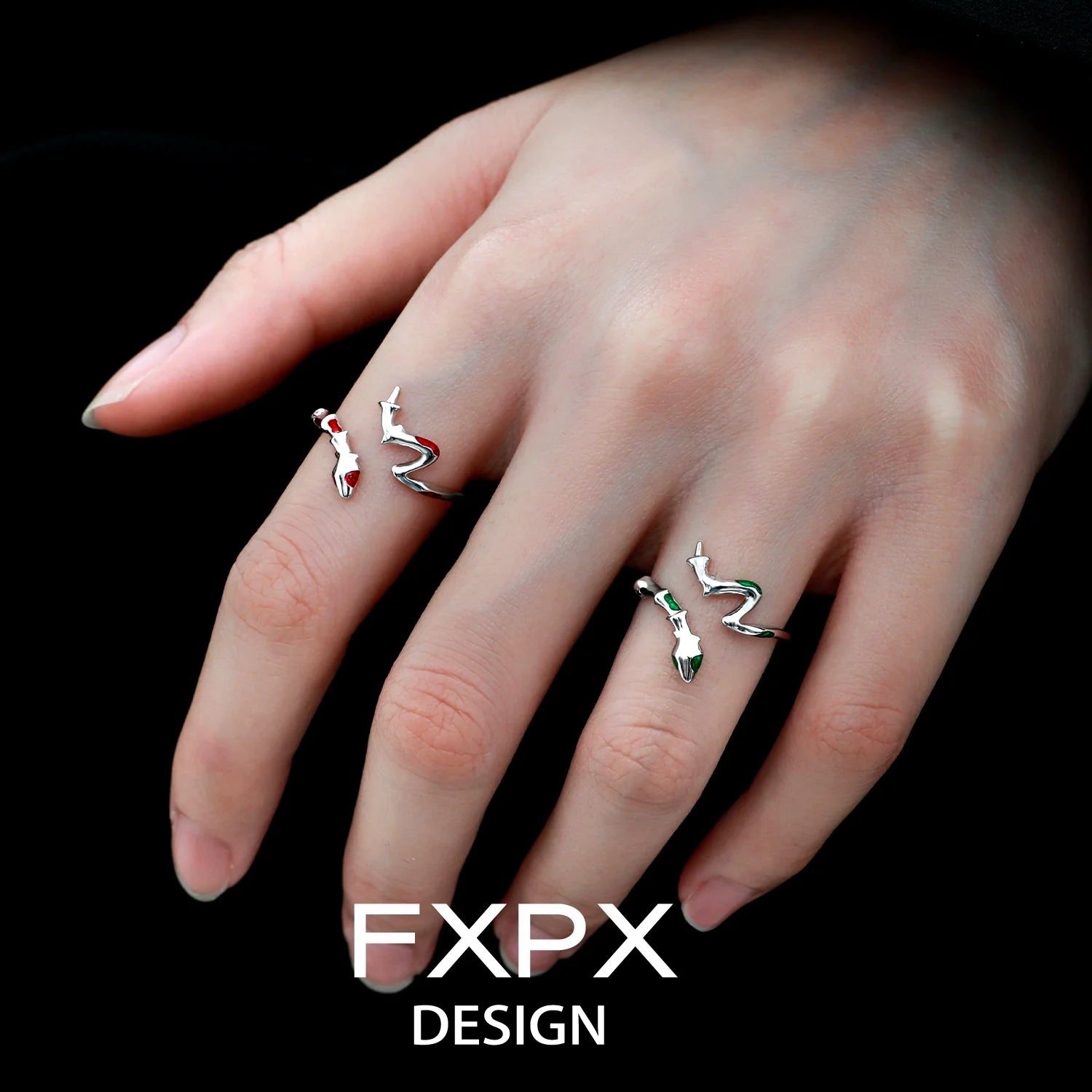 Stylish FXPX serpentine rings worn on fingers, featuring unique twisted designs and elegant silver finish