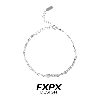 Elegant FXPX silver bracelet for women with twisted design and adjustable chain closure