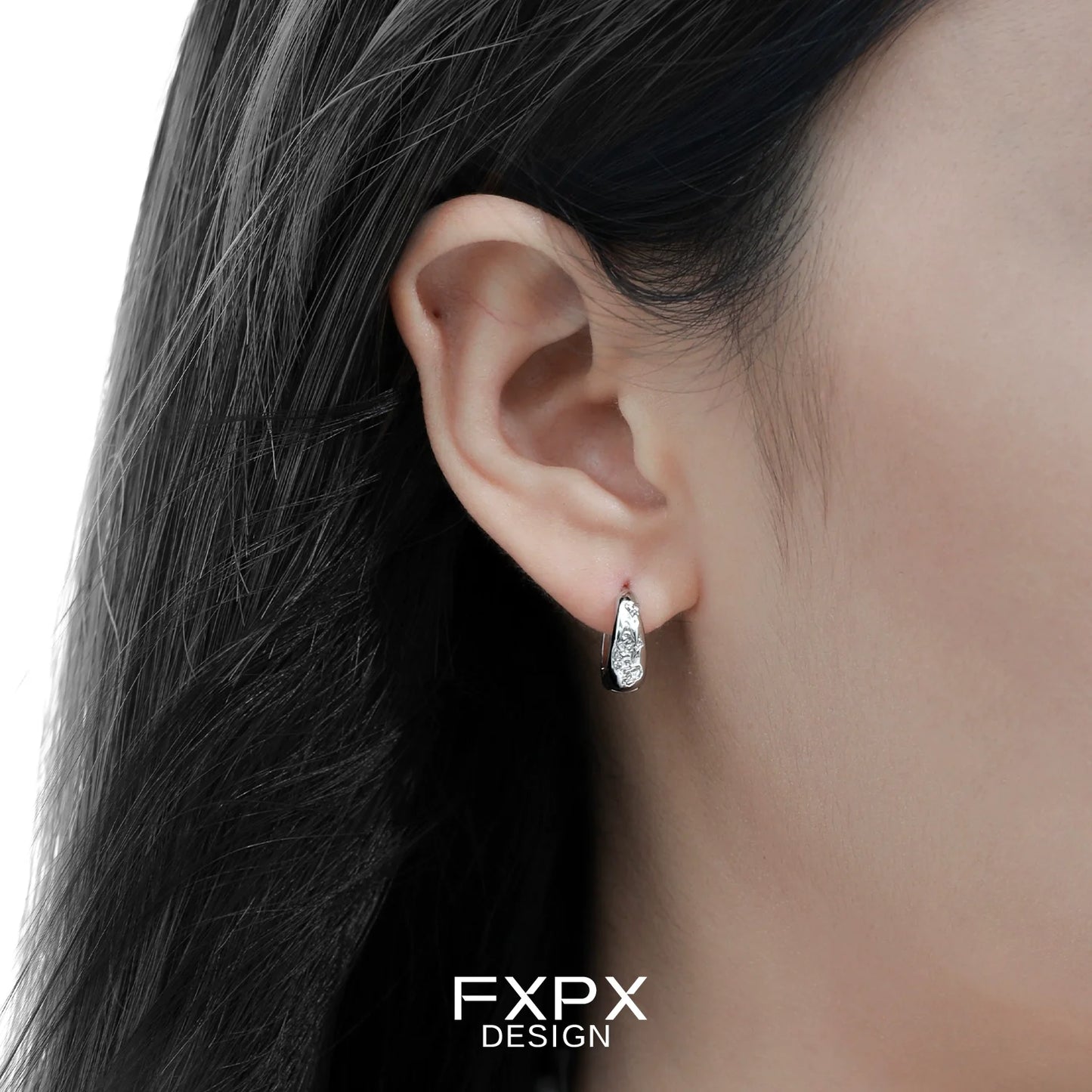 Elegant FXPX silver ear clips for women featuring a stylish and modern design