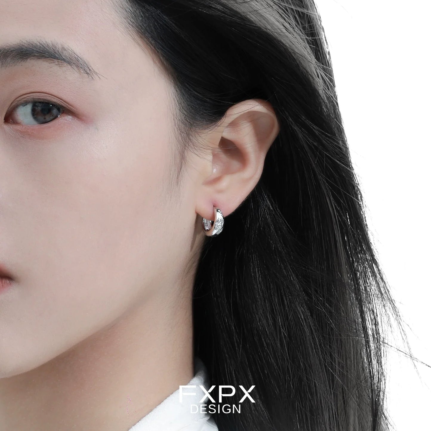 Elegant silver ear clips for women with a modern design, perfect for everyday wear