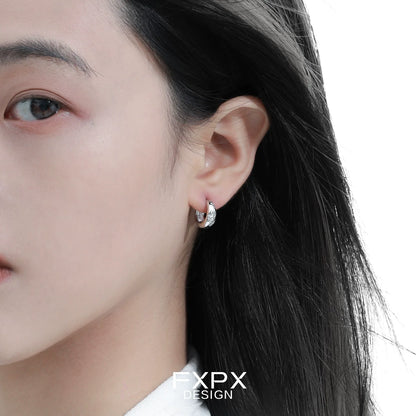 Elegant silver ear clips for women with a modern design, perfect for everyday wear