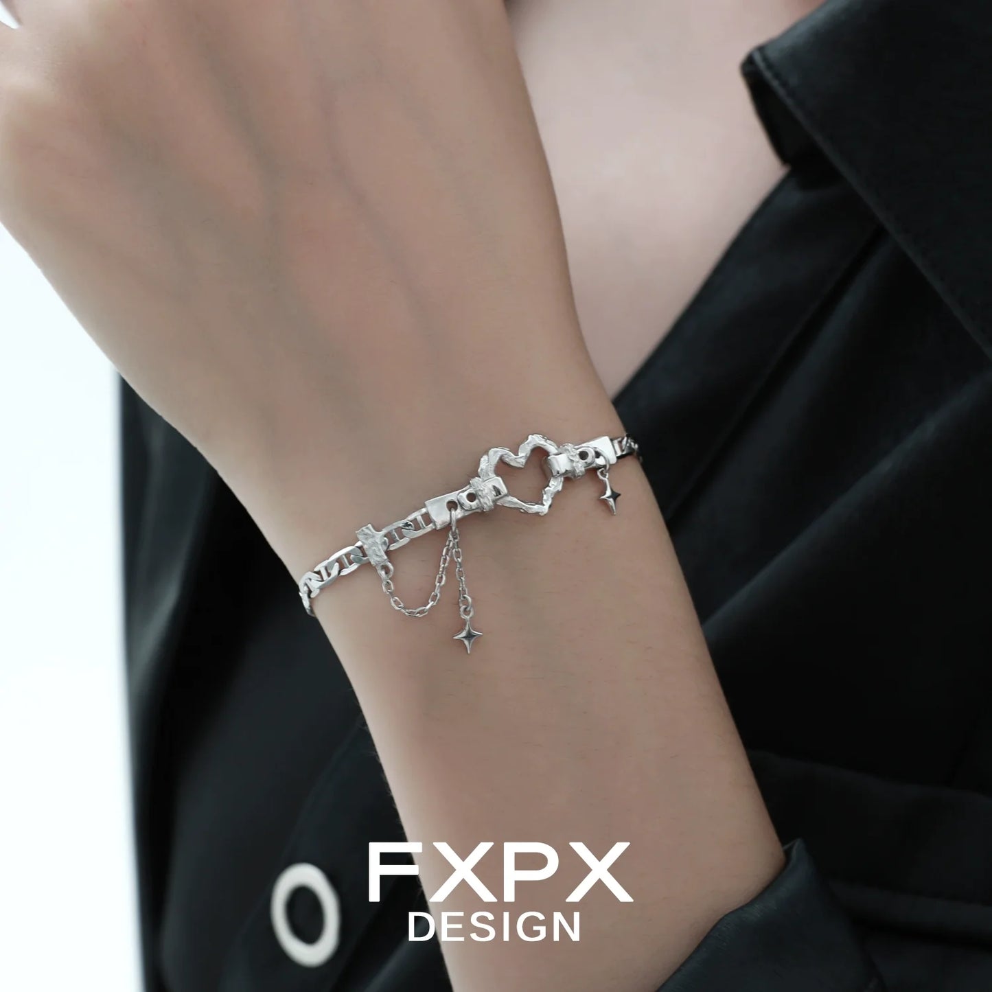 Silver geometric heart bracelet by FXPX with delicate chain and star charms for stylish elegance