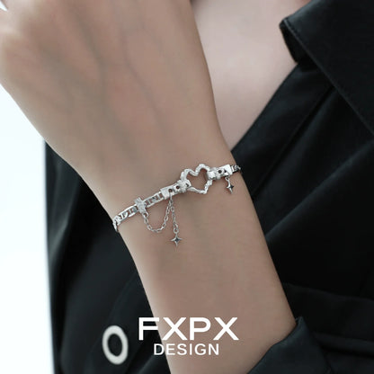 Silver geometric heart bracelet by FXPX with delicate chain and star charms for stylish elegance