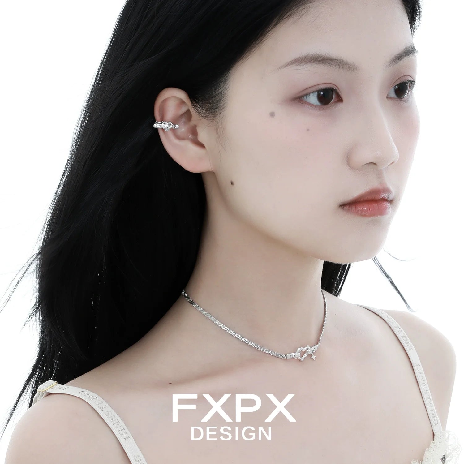 Elegant FXPX silver heart belt necklace displayed on a model showcasing its delicate design