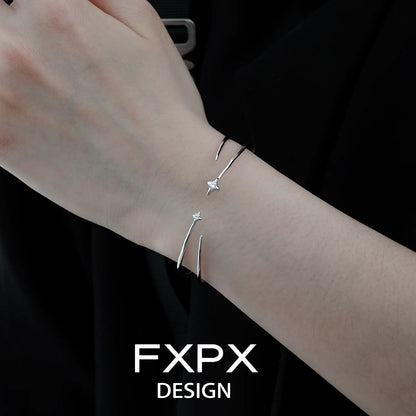 Elegant FXPX silver star bracelet on a woman's wrist for a stylish and modern look