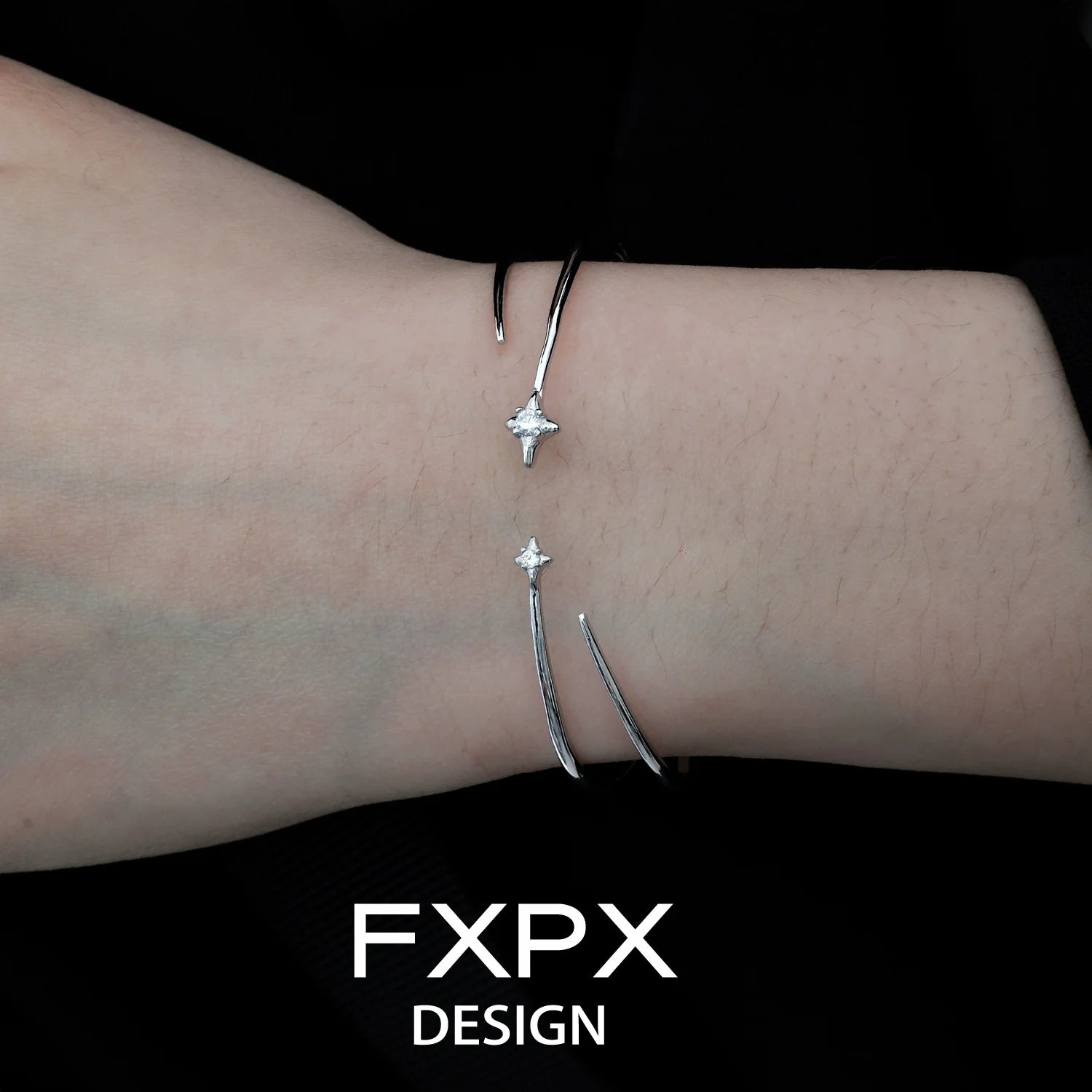 FXPX silver star bracelet featuring a sleek design with star accents on a stylish cuff