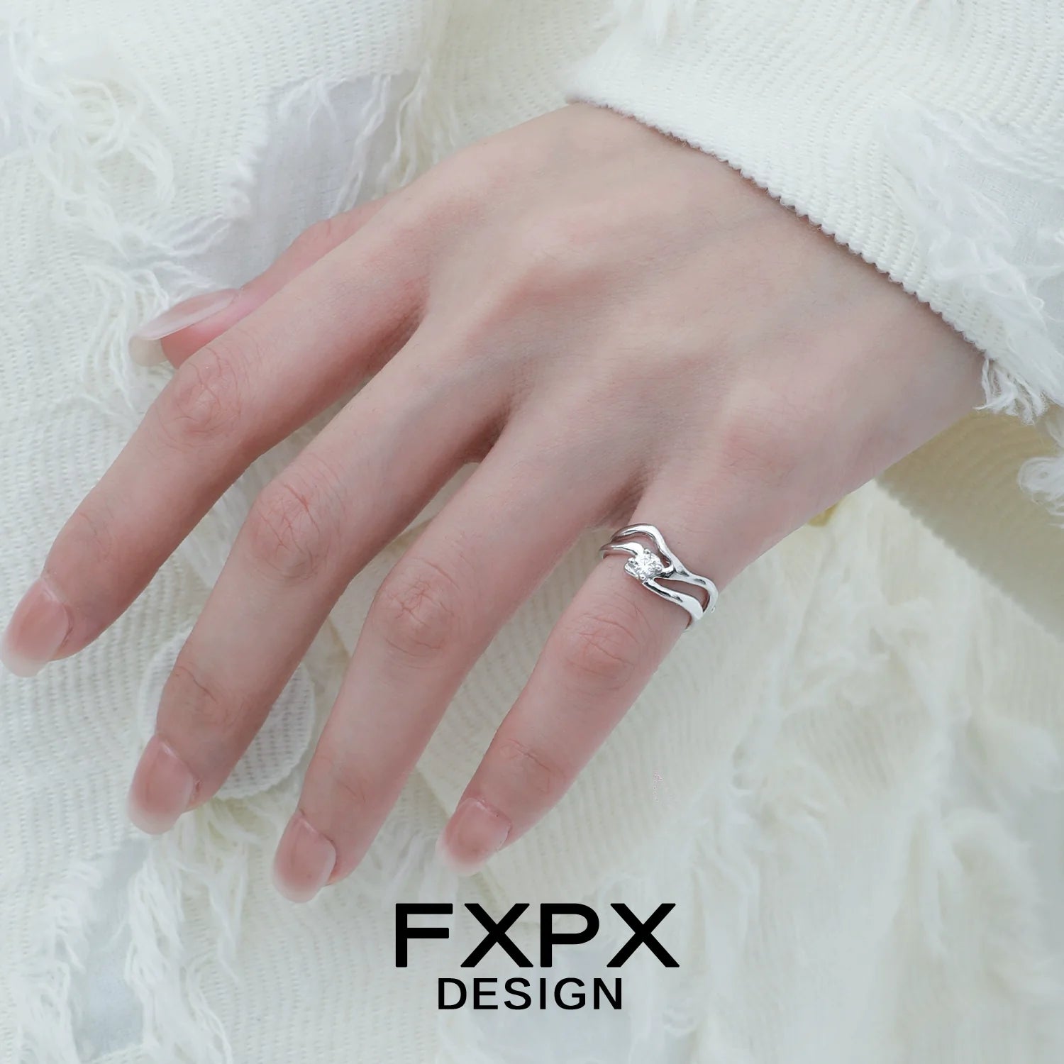 Stylish silver wave zircon ring showcased on a model's hand, perfect for elegant occasions