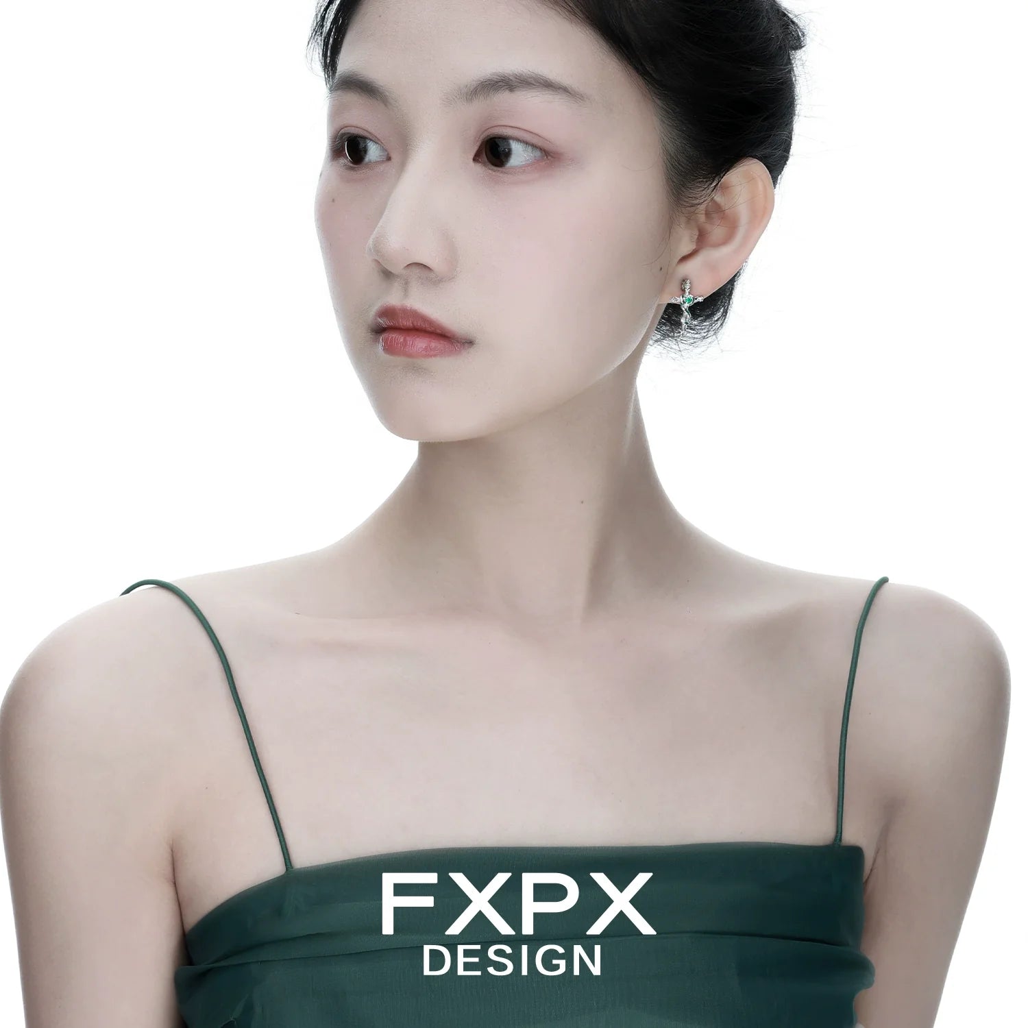 Elegant FXPX snake cross earrings worn by a model showcasing modern jewelry design