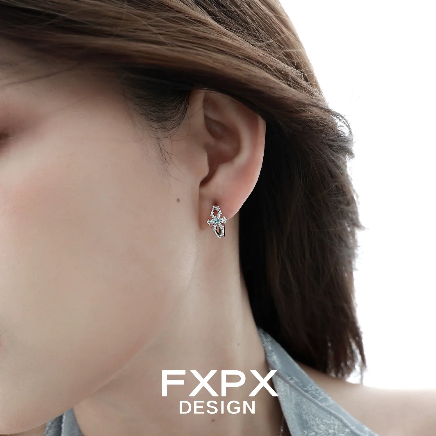 Elegant FXPX snowflake cross earrings featuring sparkling crystals and a delicate design