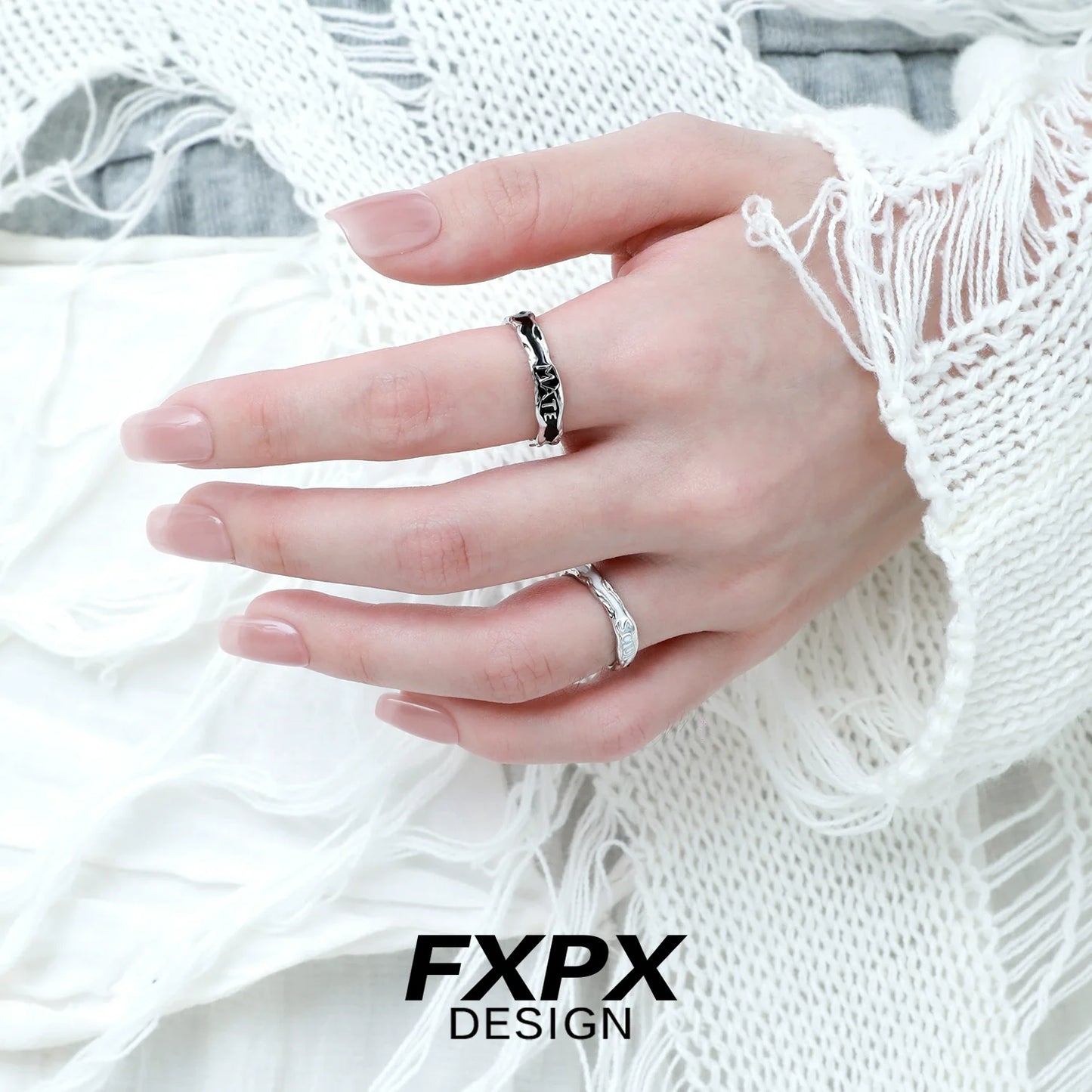 Two stylish FXPX rings on a hand, featuring a soulmate engraved ring for meaningful connections