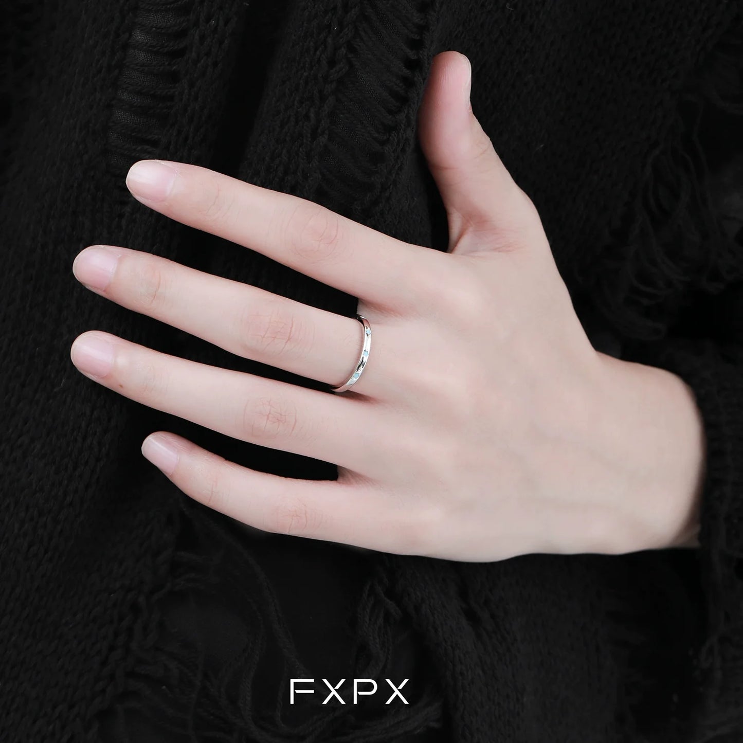 Elegant FXPX star ring for women displayed on a hand with minimalist design
