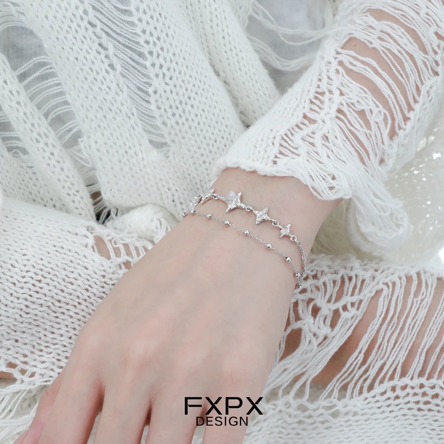 Elegant FXPX star silver bracelet featuring delicate star and bead accents for a stylish look