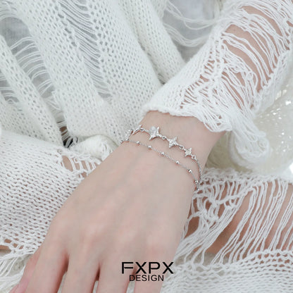 Elegant FXPX star silver bracelet featuring delicate star and bead accents for a stylish look