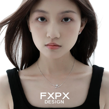 Elegant FXPX starfish necklace on a model, showcasing a delicate design for ocean lovers