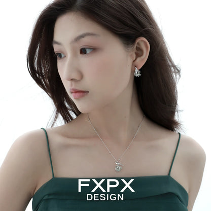 Swallow fluorite silver necklace showcased on model wearing elegant attire