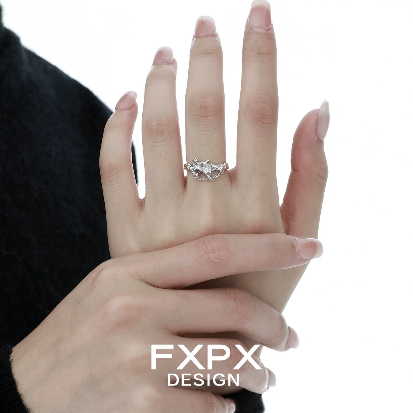 Stylish FXPX sword cross ring featuring intricate design on a hand for elegant accessory lovers