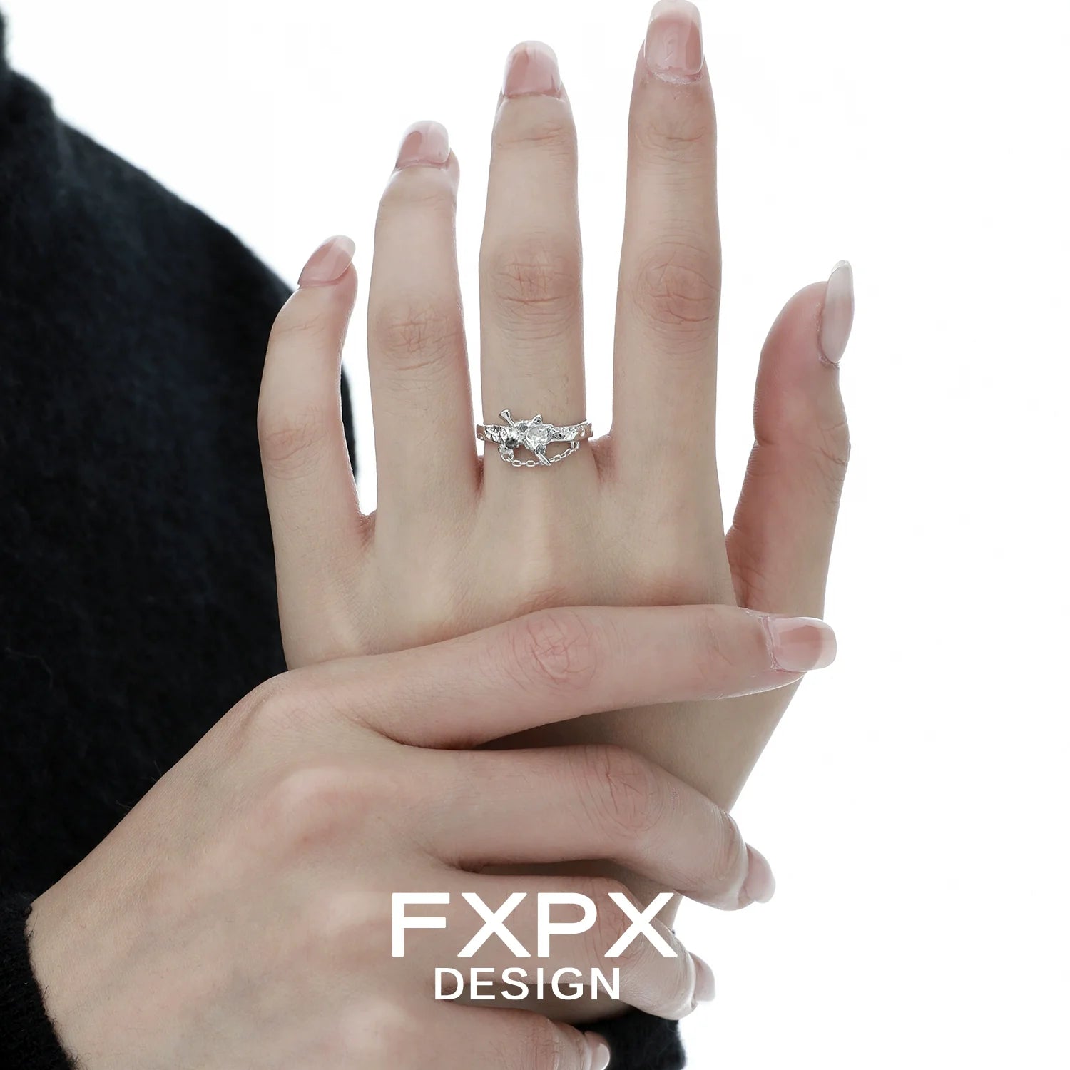 Stylish FXPX sword cross ring featuring intricate design on a hand for elegant accessory lovers