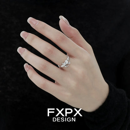 FXPX sword cross ring displayed on a model's hand, featuring intricate design and silver finish