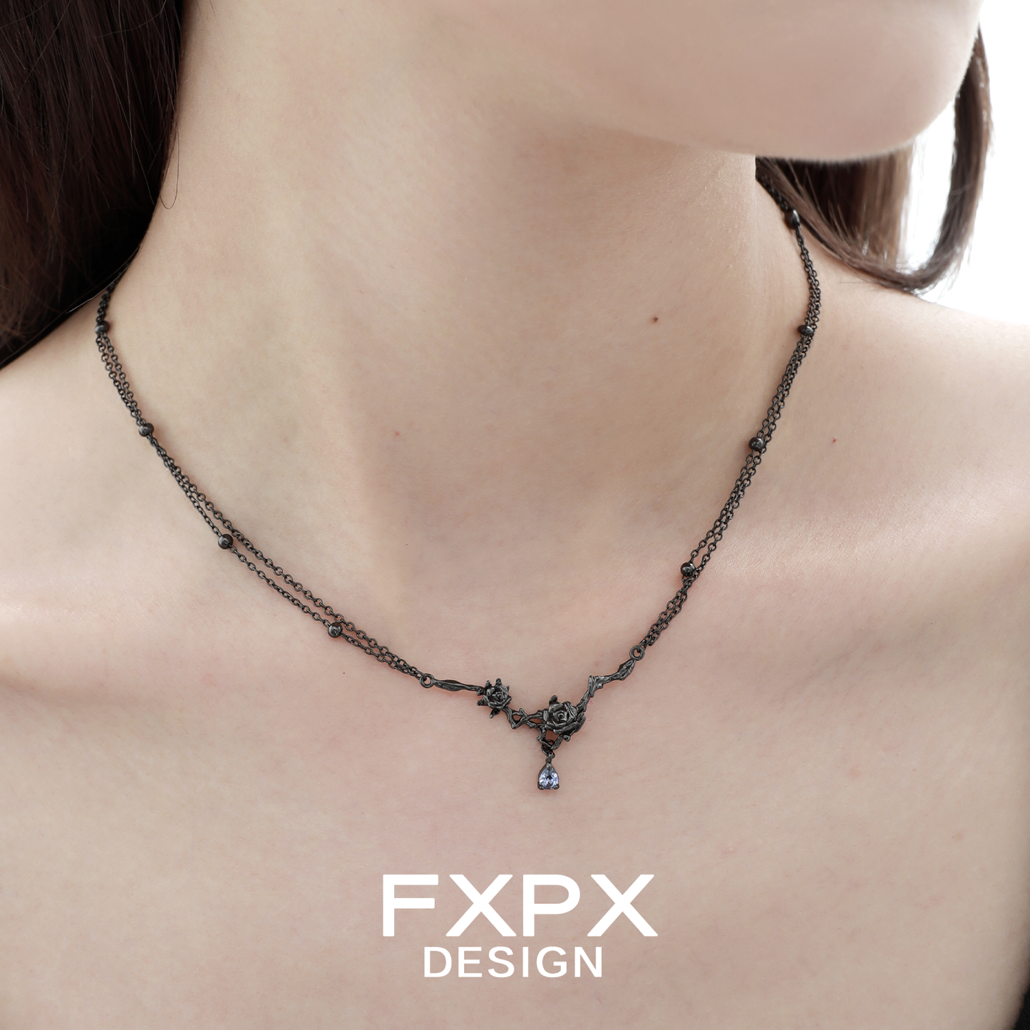 Elegant Tanzanian blue black rose necklace on a model highlighting its intricate design