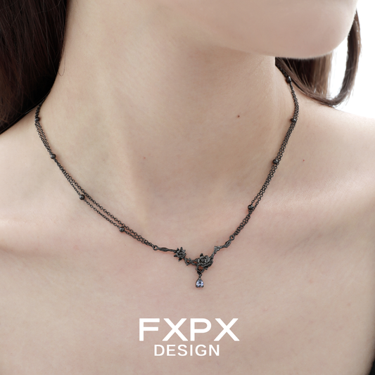 Elegant Tanzanian blue black rose necklace on a model highlighting its intricate design