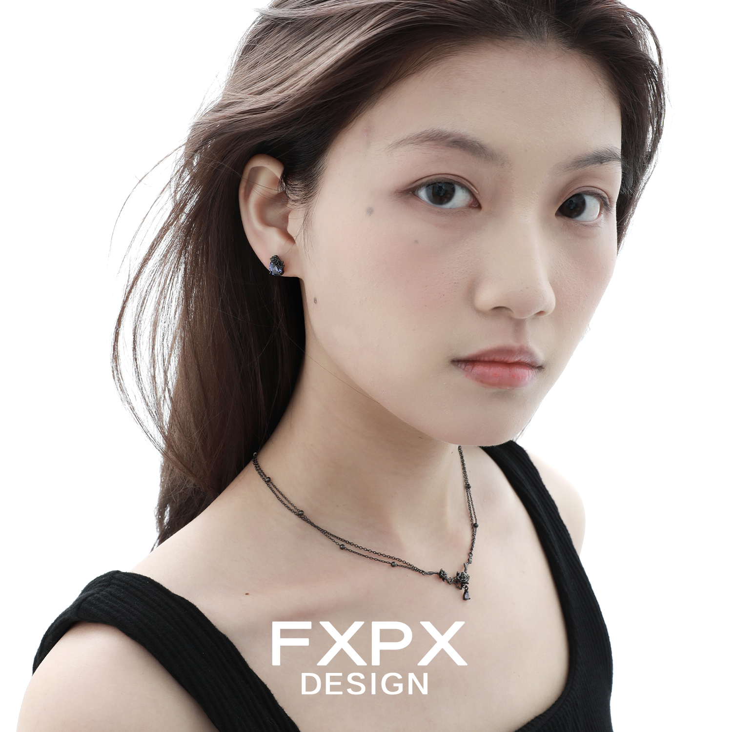 Elegant FXPX Tanzanian blue black rose necklace worn by a model with natural makeup