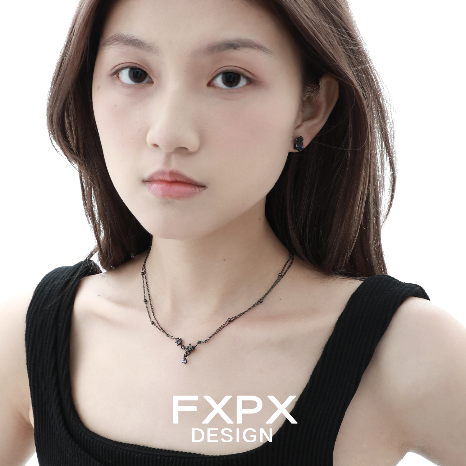 Tanzanian blue black rose necklace showcased on model wearing matching earrings