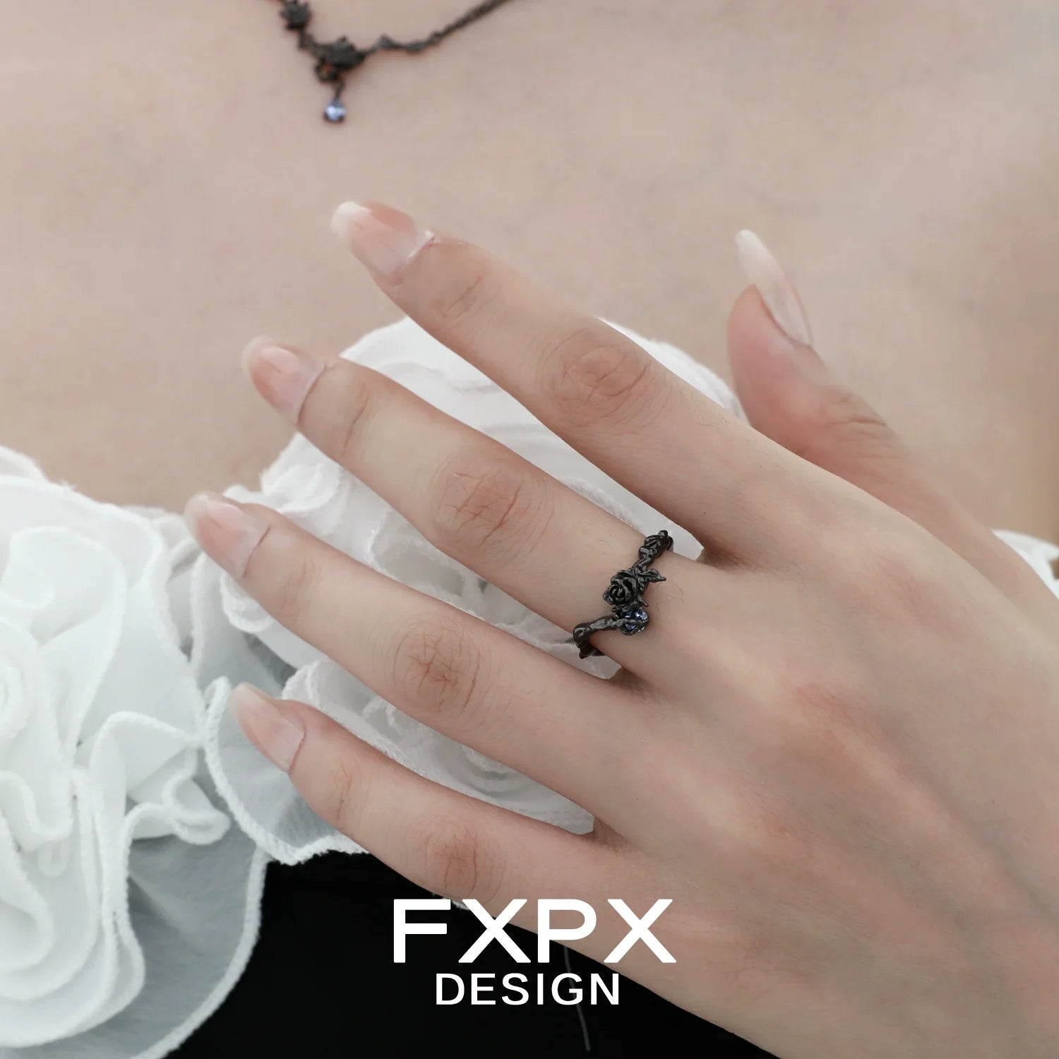 Elegant FXPX Tanzanian blue rose ring showcased on a model's hand, highlighting its intricate design