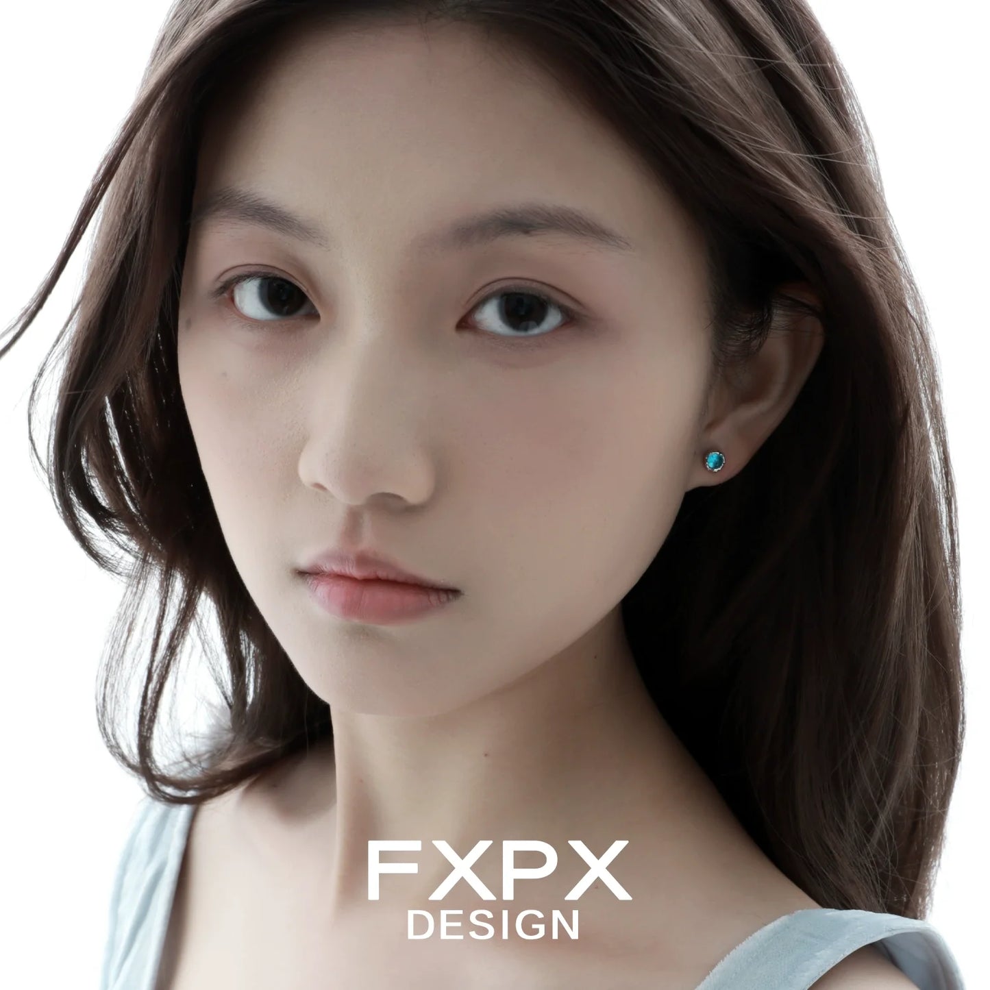 Model wearing turquoise blue screw stud earrings showcasing elegant design and vibrant color
