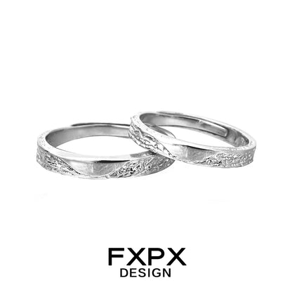 Unique couple rings by FXPX featuring textured designs for a distinctive pairing