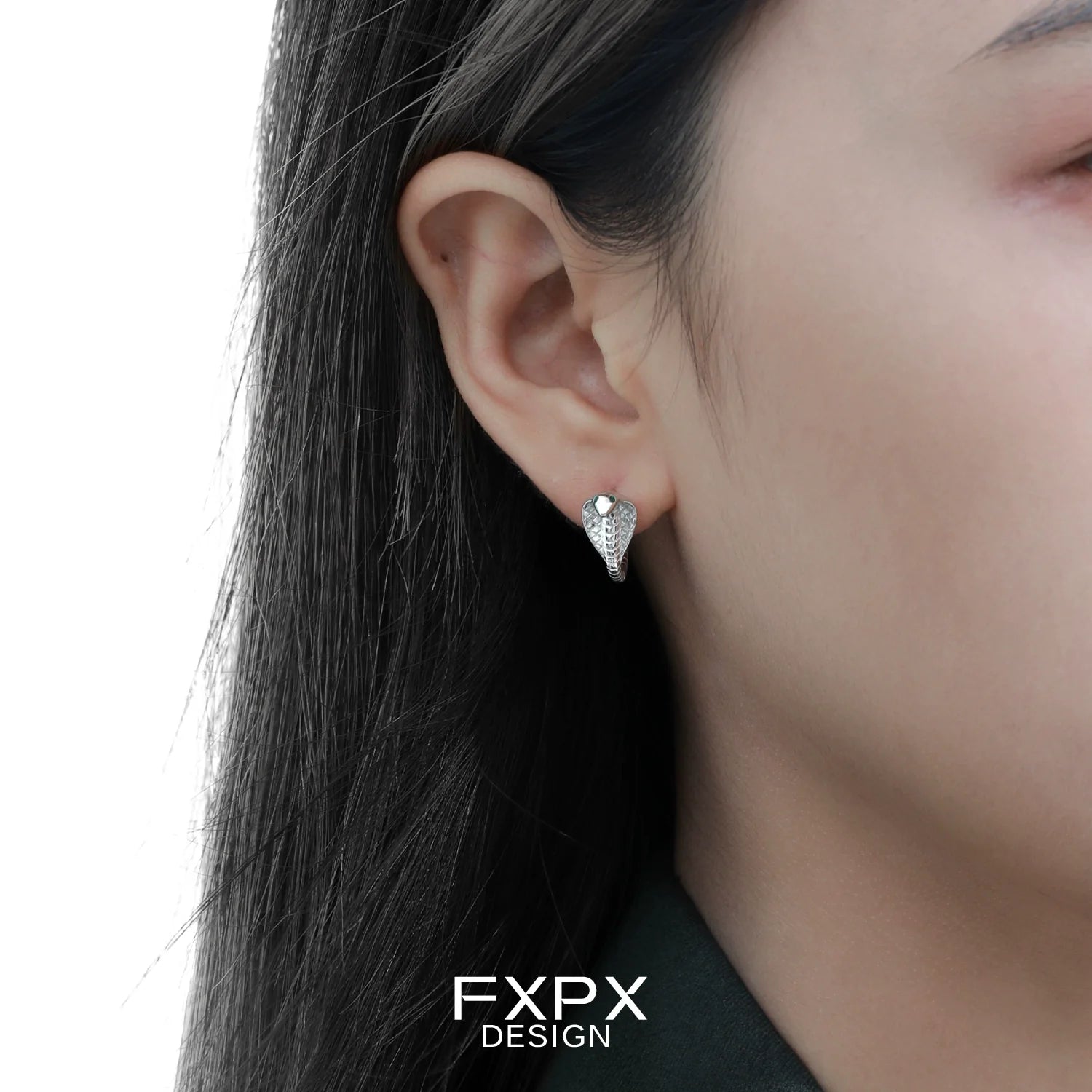 FXPX unique serpent earrings for women showcasing a stylish design on model's ear