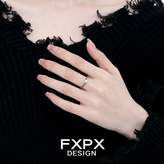 Elegant vintage checkerboard star ring showcased on a hand with a black textured background
