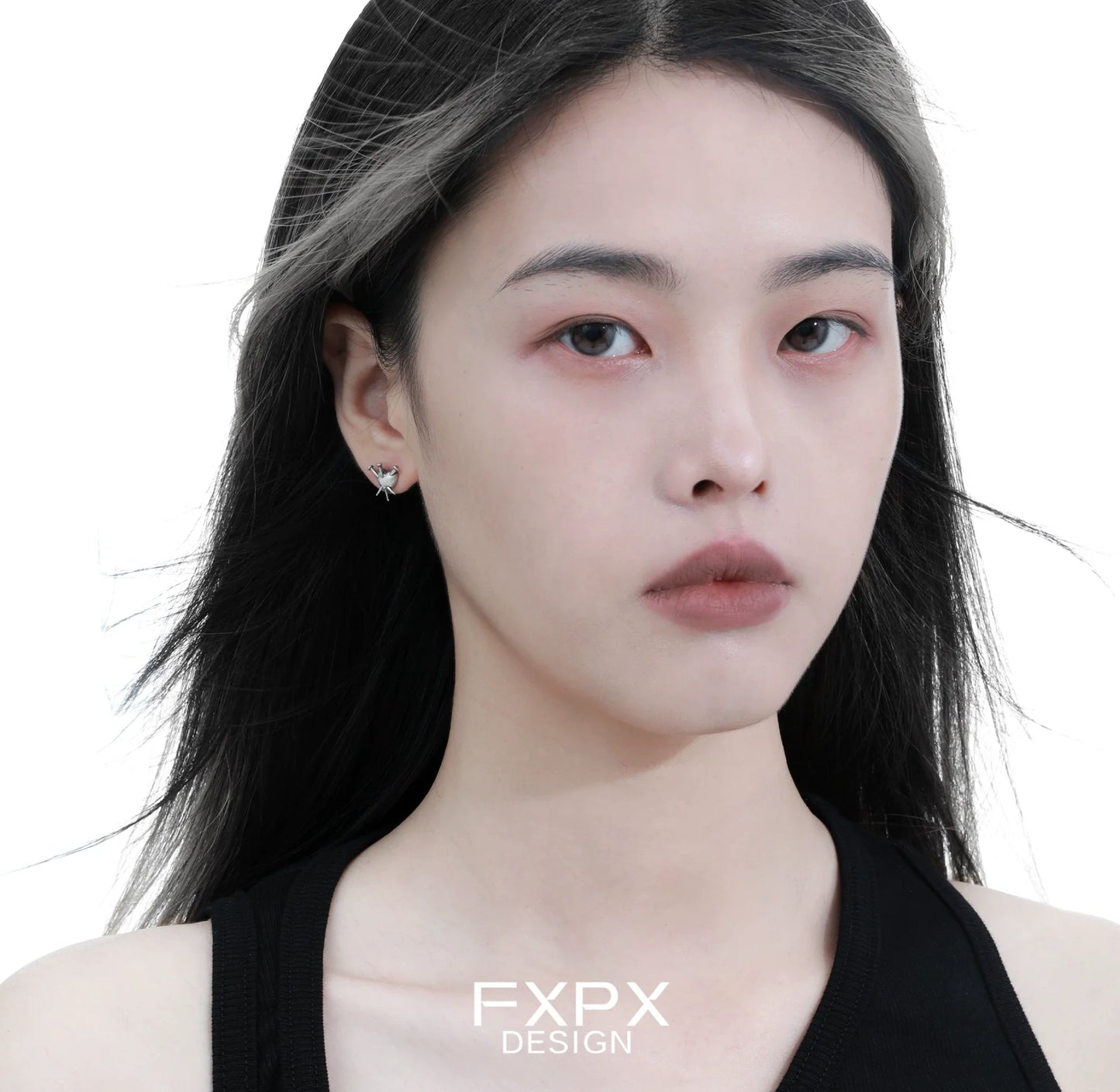 Stylish vintage punk silver earrings showcased on a model with long black hair